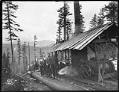 Image of Loggers at top of log chute, circa 1902