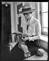 Image of University of Washington student Geraldine Gilbert knitting, Seattle, 1918
