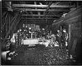 Image of Men working inside San Juan Fish Co., Seattle, 1905