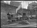 Image of Steam shovel and locomotive at Denny regrade site, Seattle, circa 1909