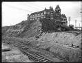 Image of Washington Hotel during regrading of Second Avenue, Seattle, circa 1906