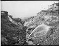 Image of Using water hoses to regrade Denny Hill, circa 1909