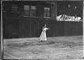 Image of Woman playing tennis, probably in Seattle, circa 1910