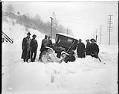 Image of Passengers and jitney bus stalled in the snow, February 2, 1916
