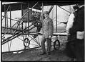 Image of Charles K. Hamilton and his Curtiss biplane, March 1910