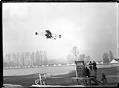 Image of Charles Hamilton's biplane in flight, 1910