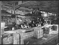Image of Men packing shingles, circa 1915