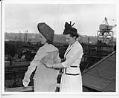 Image of Women demonstrating welding suit at Associated Shipyards, Seattle, 1943