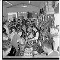 Image of Interior of a souvenir shop filled with fairgoers on closing day, Seattle World's Fair, October 21, 1962