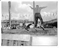 Image of Logrollers at a lumberjack show, Seattle World's Fair, 1962
