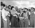 Image of Mexican farm workers receiving paychecks, Skagit Valley, 1943