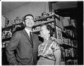 Image of Wing Luke and his mother inside a store, probably in Seattle, 1962