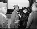 Image of Eleanor Roosevelt awarding medal to soldier Sam Morris, Seattle, April 3, 1943