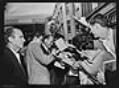Image of Elvis Presley and Governor Rosellini signing autographs, Seattle, September 5, 1962