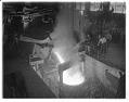 Image of Molten metal being poured into a crucible at Isaacson Iron Works, Seattle, 1943