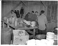 Image of Japanese American incarcerees washing dishes at the Puyallup Assembly Center, Puyallup, 1942