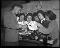 Image of Teenaged incarcerees with printing machine at the Puyallup Assembly Center, Puyallup, 1942