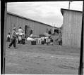 Image of Incarcerees moving into barracks at the Puyallup Assembly Center, Puyallup, 1942