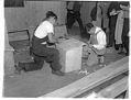 Image of Two Japanese American incarcerees doing carpentry work at the Puyallup Assembly Center, Puyallup, 1942