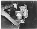 Image of Japanese American woman washing clothes at the Puyallup Assembly Center, Puyallup, 1942