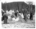 Image of Men stuffing mattresses for camp, Civilian Conservation Corps, Longmire, circa 1937
