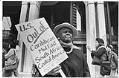 Image of Maryamu Eltayeb protesting outside Federal Building against US invasion of Grenada, October 26, 1983