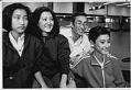 Image of Hoang Xuan Thuy and family at Sea-Tac Airport, January 17, 1990