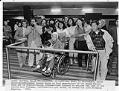 Image of Huynh family waiting to greet family from Vietnam at Sea-Tac Airport, March 25, 1985