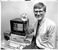 Image of Carl Stork with Microsoft demonstration disk, Redmond, February 1987