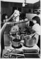 Image of Phuong Nguyen cooking in her restaurant, Seattle, September 1978