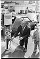 Image of City Light superintendent Gordon Vickery charging an electric car at a parking meter, Seattle, May 3, 1973