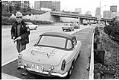 Image of State Patrol officer issuing ticket under new 50 MPH speed limit, Seattle,  November 1973