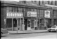 Image of View of King Street businesses, Seattle, December 1973