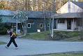 Image of Larry Yanity walking past homes to be razed for new casino, Arlington, January 9, 2003