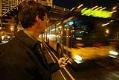Image of Mark Hallenback using the Mybus program on his phone, January 28, 2003