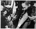 Image of Dan Evans greeting Vietnamese children at Camp Murray, Washington, May 20, 1975