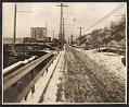 Image of View of street and flour mill, looking southeast on Alki Avenue, March 19, 1913