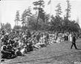 Image of Spectators seated on lawn for the 