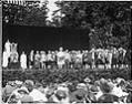 Image of Performers in colonial dress and others at the 
