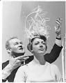 Image of Model Donna Rydberg and hat designer John Eaton, Seattle, 1962