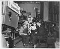 Image of Worker being interviewed for a documentary at the Currin-Greene Shoe Manufacturing Company, Seattle, 1959