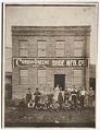Image of Workers standing outside the Currin-Greene Shoe Manufacturing Company, Seattle, 1917