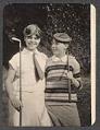 Image of Two children holding golf clubs, ca. 1920
