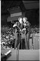 Image of Paul McCartney and George Harrison singing during the Beatles concert at Seattle Center Coliseum, August 21, 1964