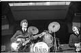 Image of George Harrison and John Lennon performing at the Beatles concert, Seattle Center Coliseum, August 21, 1964