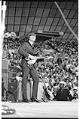 Image of John Lennon performing during the Beatles concert at Seattle Center Coliseum, August 21, 1964