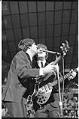 Image of Paul McCartney and John Lennon singing at the Beatles concert at Seattle Center Coliseum, August 21, 1964
