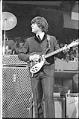 Image of John Lennon performing at the Beatles concert, Seattle Center Coliseum, August 21, 1964