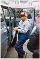 Image of Bob Santos entering police van at protest at the South African consulate, Seattle, December 9, 1984