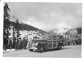 Image of KIRO mobile news station wagon parked on mountain road, circa 1942
